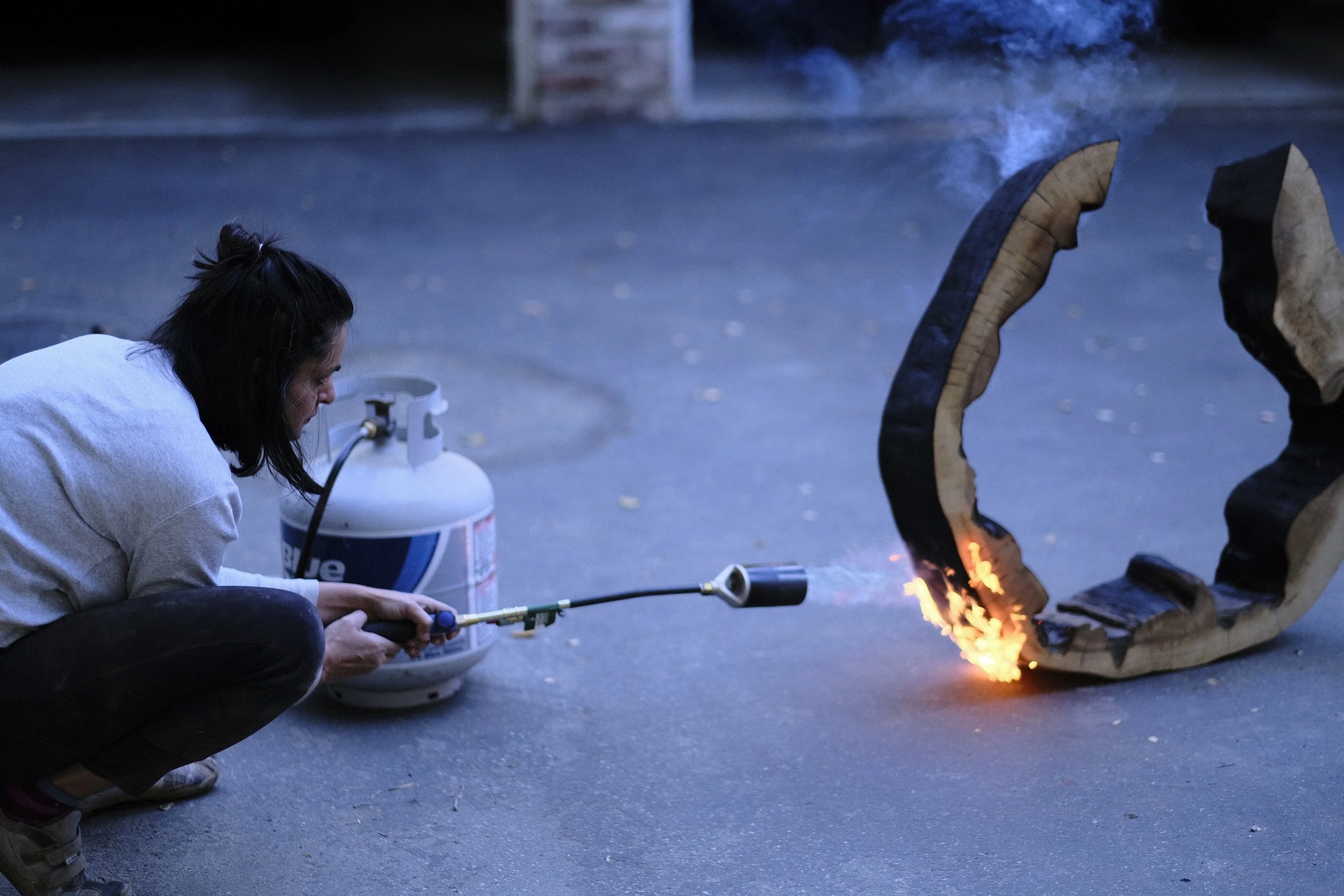 Studio record — Priyanka Rana at work on a wood sculpture.