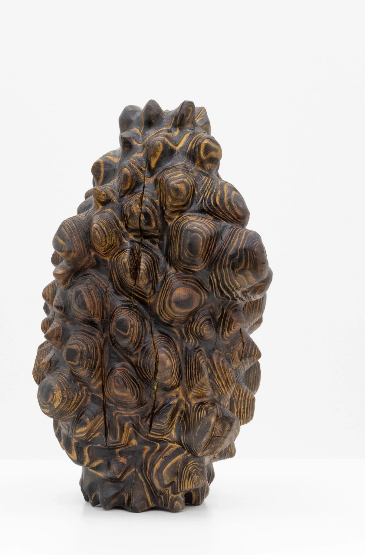 Born of Wood — a carved wood sculpture.
