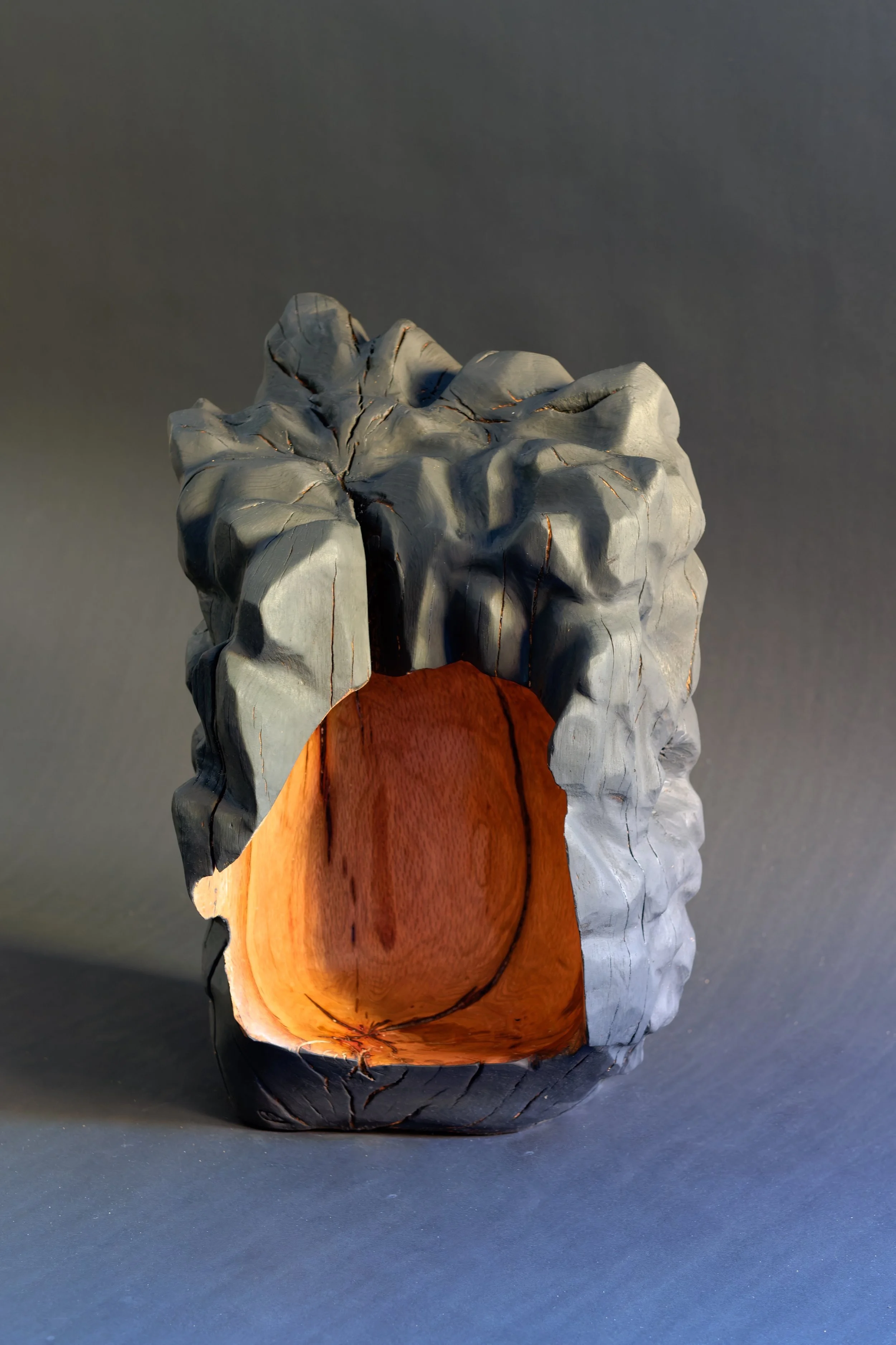 Dear Child, Safe Space — a partially charred oak sculpture.