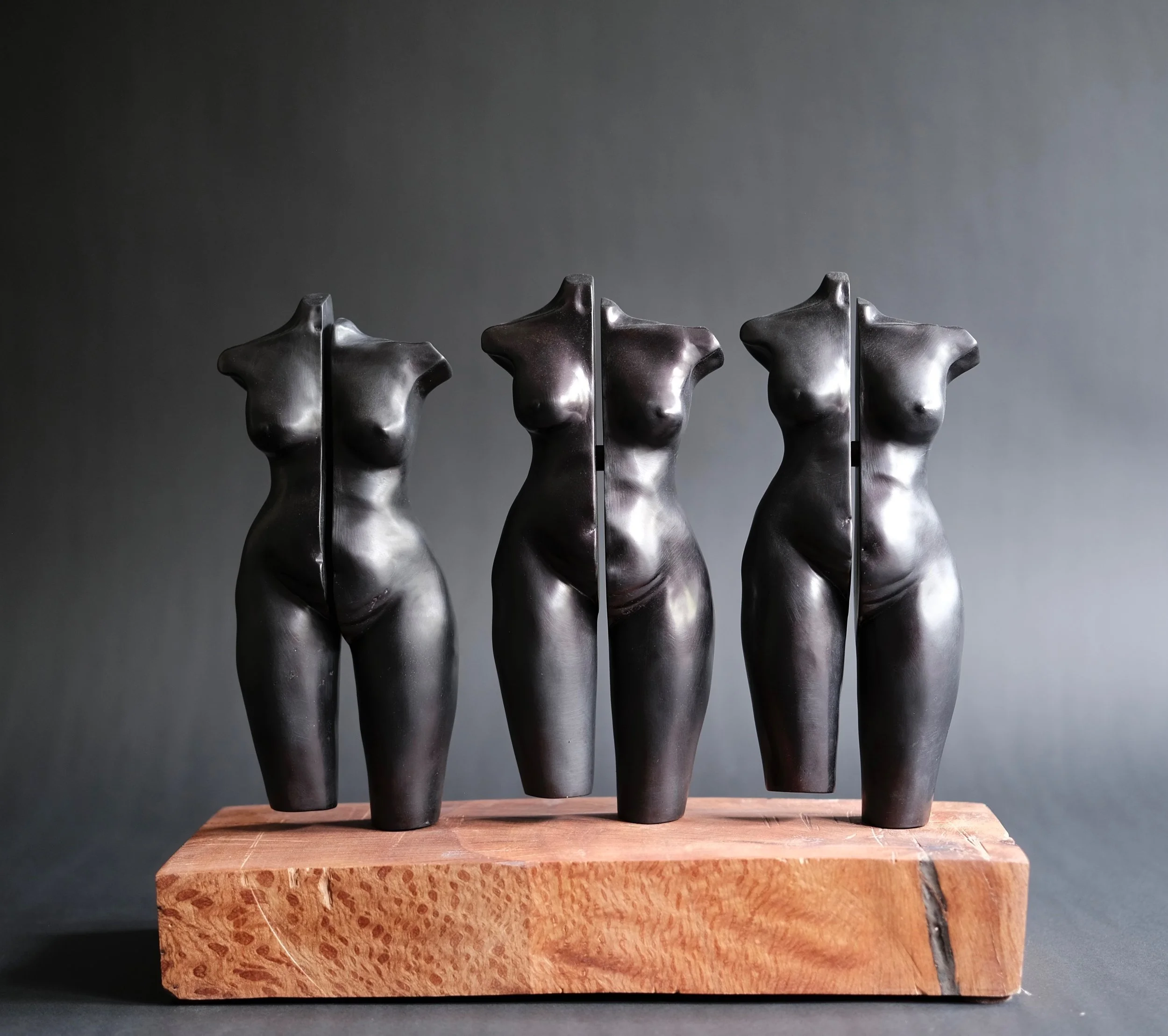 Distancing — a sculpture of ceramic and wood.