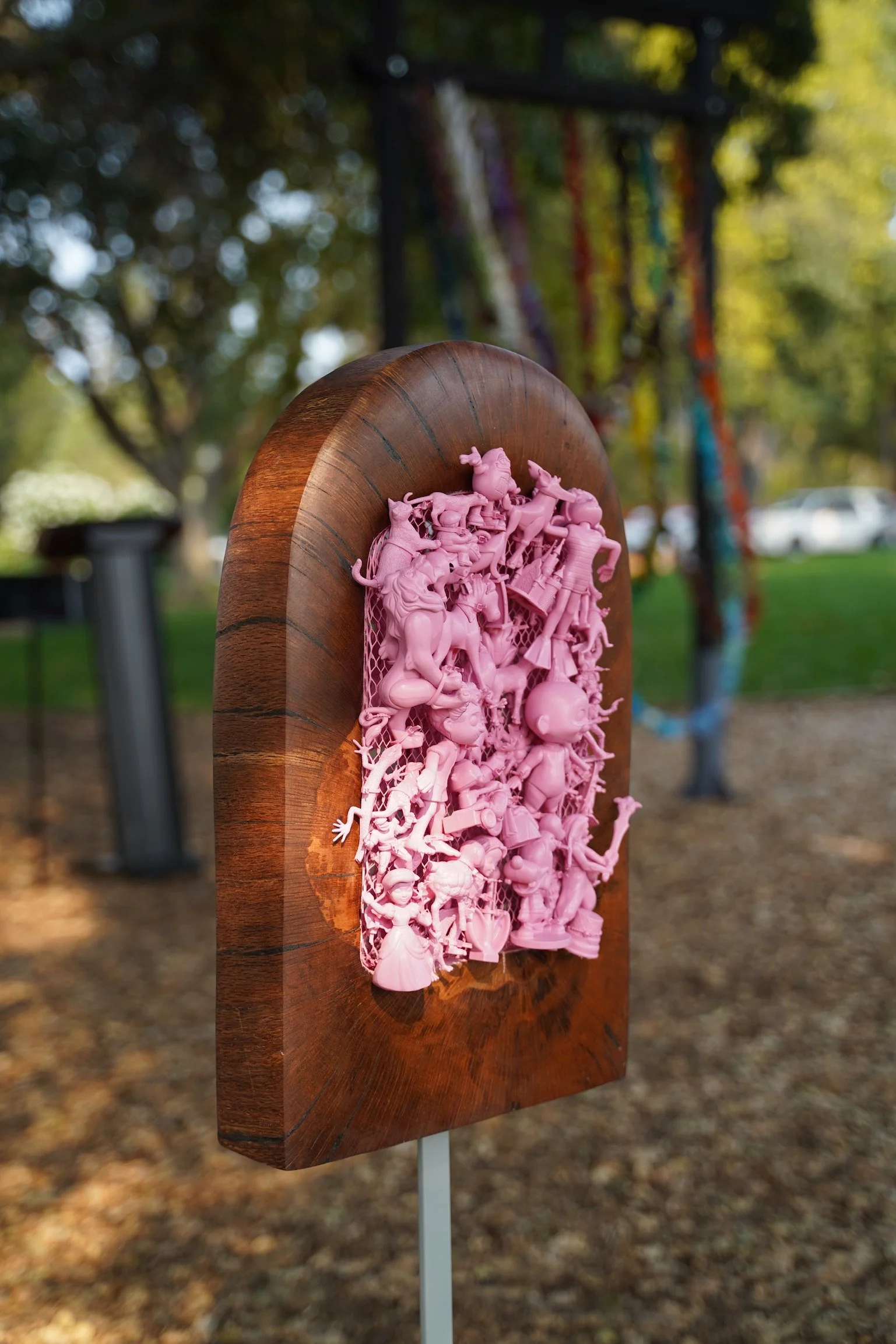What's At Play — a sculpture of repurposed toys and wood.